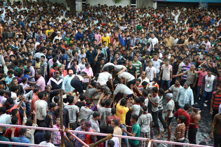 AMRAVATI, MAHARASHTRA, INDIA - AUGUST 29 : Crowd of young People enjoying "Govinda" at Dahi Handi festival to celebrate God Krishna's Birth in Amravati, Maharashtra, India. 29 August 2013のeditorial素材
