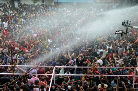 AMRAVATI, MAHARASHTRA, INDIA - AUGUST 29 : Crowd of young People enjoying "Govinda" at Dahi Handi festival to celebrate God Krishna's Birth in Amravati, Maharashtra, India. 29 August 2013のeditorial素材