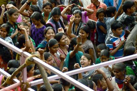 AMRAVATI, MAHARASHTRA, INDIA - AUGUST 29 : Crowd of young People enjoying "Govinda" at Dahi Handi festival to celebrate God Krishna's Birth in Amravati, Maharashtra, India. 29 August 2013のeditorial素材