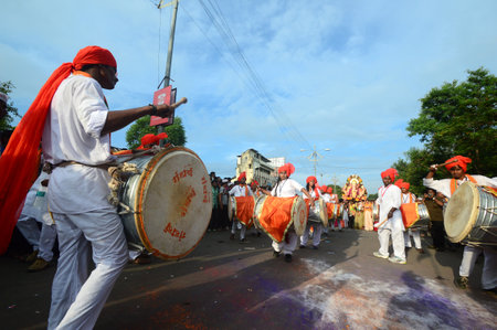 AMRAVATI, MS, INDIA - SEPTEMBER 11: Ganesha idols are being transported for immersion with drums in water bodies on September 11, 2014 in Amravati, Maharashtra, India. This is an annual festival.のeditorial素材
