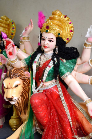 NAGPUR, MS, INDIA - OCT 12: An unidentified artist makes sculptures of goddess Durga on October 12,...