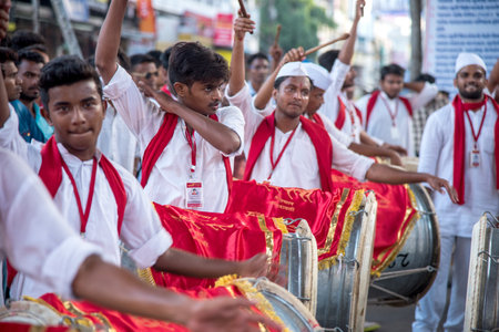 AMRAVATI, MAHARASHTRA, INDIA - SEPTEMBER 05: Lord Ganesha procession for Ganesh Chaturthi, people celebrating Ganesh Chaturthi with music and drums on September 05, 2016 in Maharashtra, India.のeditorial素材