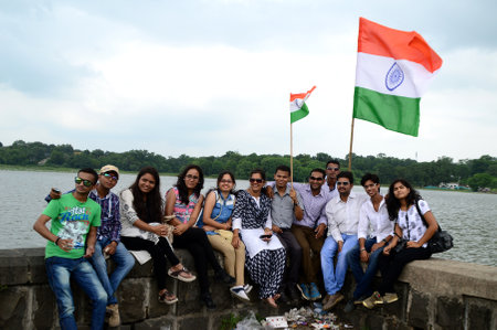 NAGPUR, MAHARASHTRA, INDIA, AUGUST - 15 : Unidentified people celebrating Independence Day by dancing and waving Indian flag (tri-colour) at futala lake in Nagpur on 15 August 2015のeditorial素材