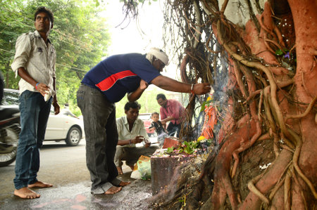 NAGPUR, MAHARASHTRA, INDIA - AUGUST 01 : People worship of Snake God in "Nag Panchami" festival. It is traditional worship of snakes or serpents observed by Hindus in Nagpur, India on 01 August 2014のeditorial素材