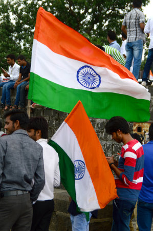 NAGPUR, MAHARASHTRA, INDIA, AUGUST - 15 : Unidentified people celebrating Independence Day by dancing and waving Indian flag (tri-colour) at futala lake in Nagpur on 15 August 2015のeditorial素材