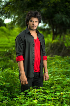 Handsome fashion young man posing outdoors