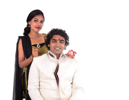 Indian brother and sister enjoying and celebrating Raksha Bandhan festivalの写真素材