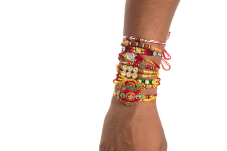 Young men showing rakhi on his hand on an occasion of Raksha Bandhan festival.