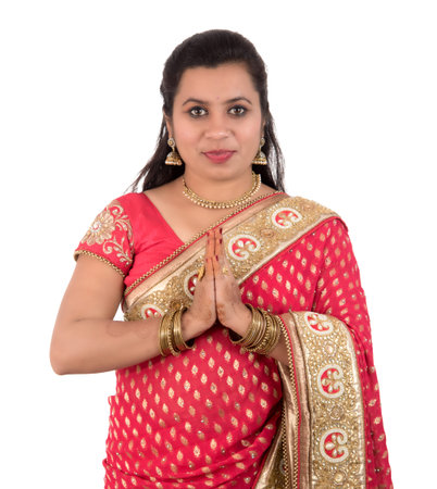 Beautiful Indian girl in a tradition sari with welcome expression (inviting), greeting Namaste