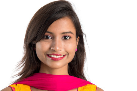 Portrait of beautiful young smiling girl on a white background.の写真素材