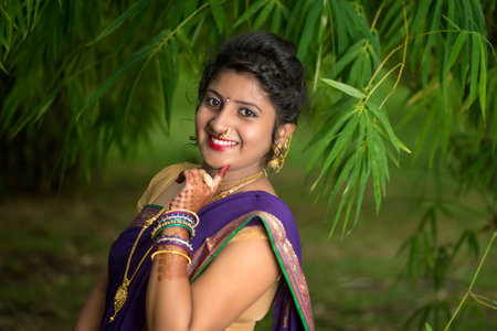 Indian Traditional Beautiful young girl in saree posing outdoors