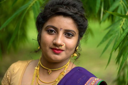 Indian Traditional Beautiful young girl in saree posing outdoorsの写真素材