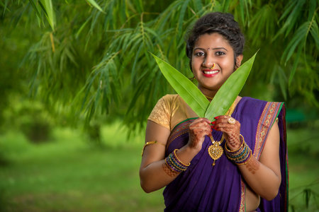 Indian Traditional Beautiful young girl in saree posing outdoorsの写真素材