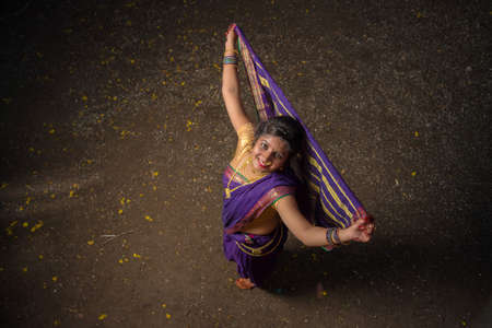 Indian Traditional Beautiful young girl in saree posing outdoorsの写真素材