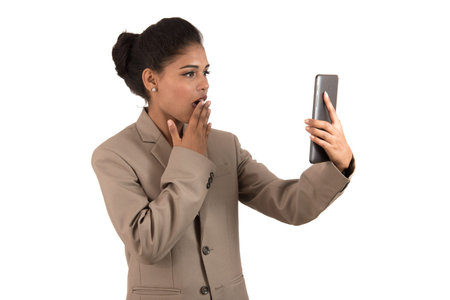 Beautiful woman talking in a video conference online by using smartphone