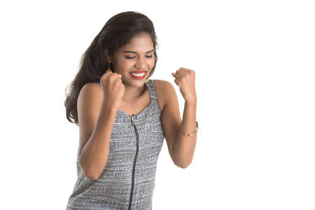 Smiling cheerful girl showing sign isolated on white backgroundの写真素材