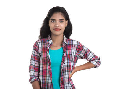 Portrait of beautiful young smiling girl on a white background.の写真素材