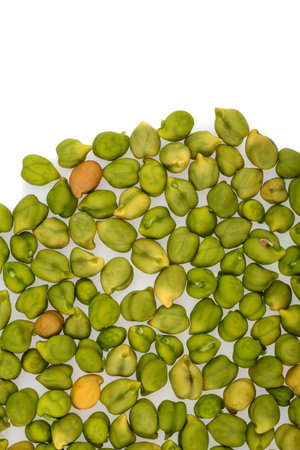 Fresh green Chickpea (Cicer arietinum) on a white background. Scattered Desi variety chickpeas.