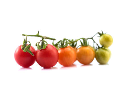 Close up of fresh cherry tomato isolated on white background.の写真素材