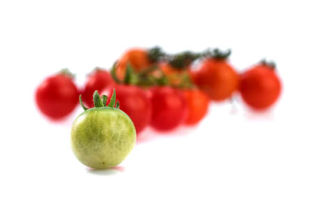 Close up of fresh cherry tomato isolated on white background.の写真素材