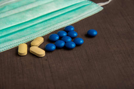 Pharmaceutical medicine tablets and medical mask. Medicine, Hygiene and Healthcare concept.の写真素材