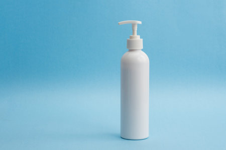 A bottle of sanitizing gel or liquid for washing hands. Cleanliness and body care concept.