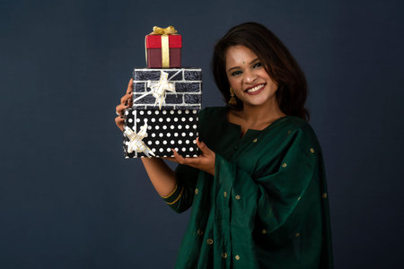 Portrait of young happy smiling woman or Girl holding gift box.