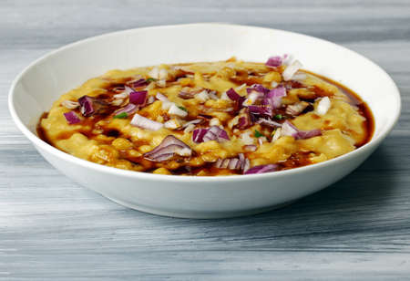 Martar Chaat or Ragda of Ragda Pattice with sweet tamarind chutney or sauce and onionsの写真素材