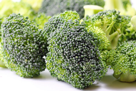 A close up of a Broccoli florets on white background, selective focus.
