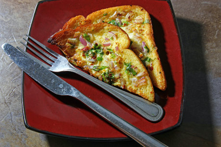 Indian version of French toast with onions and cilantro