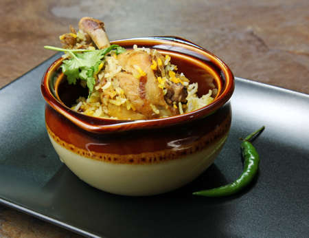 A plateful of Chicken Biryani an Indian rice meal with spicy Chicken marinated in yogurt.の写真素材