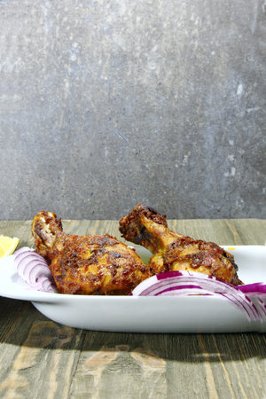 Roasted Chicken or Tandoori chicken with onion, selective focus