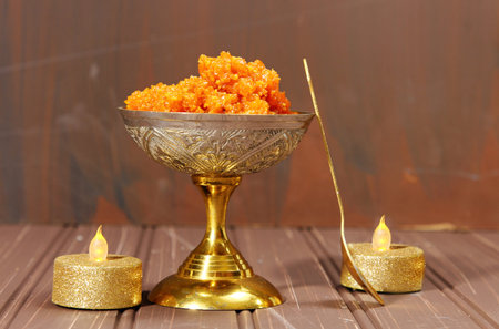 Gajar halwa or carrot dessert in a bowl on a moody dark background with copy space, selective focus.の写真素材