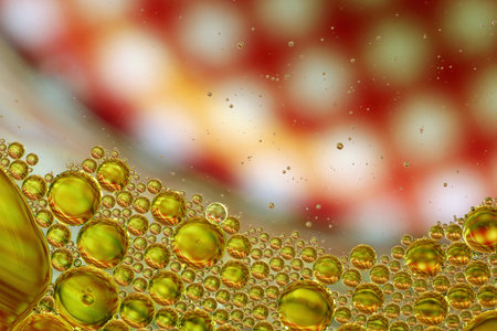 Oil in water abstract circles on a colorful green background