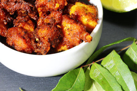 Chicken 65, an Indian appetizer chicken morsels in spicy mix and deep fried in oil, selective focus.の写真素材