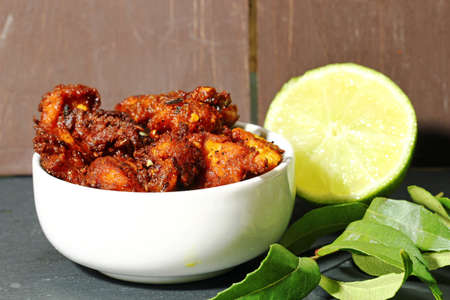 Chicken 65, an Indian appetizer chicken morsels in spicy mix and deep fried in oil, selective focus.の写真素材