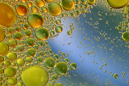 Oil in water abstract circles on a colorful blue background