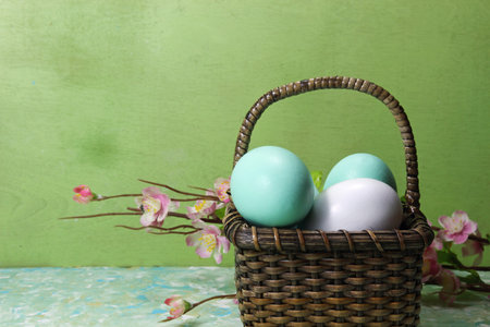 A basket of Eggs with spring flower, selective focus