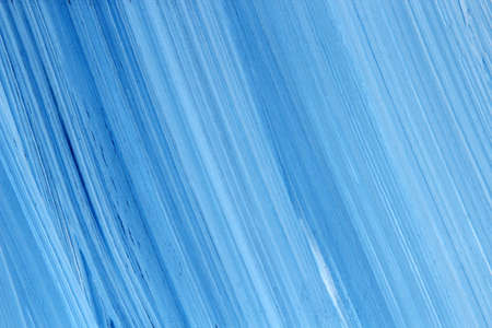 A hand painted blue textured background filling the frameの写真素材