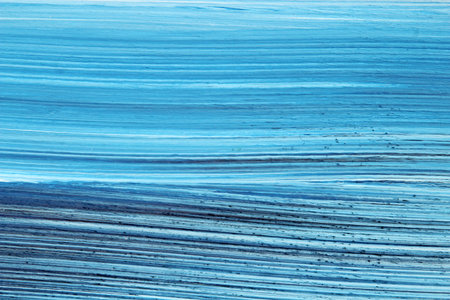 A hand painted blue textured background filling the frame