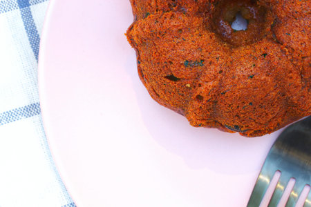 Small banana bread Bundt cakes on a wooden background with copy spaceの写真素材