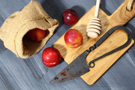 Overhead shot of Red Cherry plums on grey background