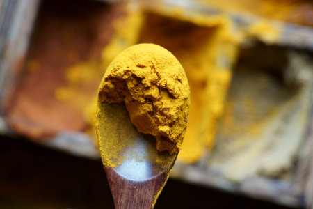 Close up of Indian spice Turmeric in a spoon.Turmeric powderの写真素材
