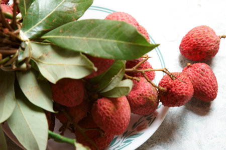 A bunch of red Lychees with copy space.