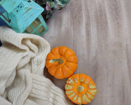 Top down view of Pumkins and swaeter and a candleの写真素材