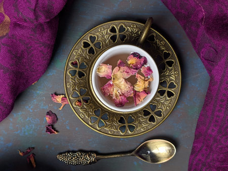 Top down view of a cup of Rose tea with a metal tea pot.の写真素材