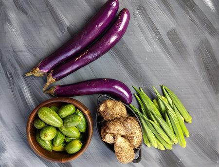 Indian vegetables of Tomatoes, Yams, Pointed gourd, Green chilies, Methi leaves, cilantro, and egg...