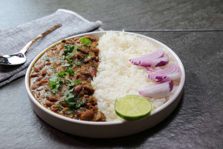 A platter of Indian red Kidney beans curry or Rajma Masala and rice with copy space.の写真素材