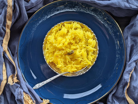 A plate or bowl of sweet yellow Zarda rice for dessertの写真素材