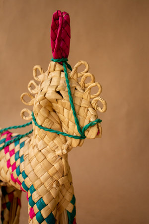 Handmade wooden toy horse on a brown background, close-upの写真素材